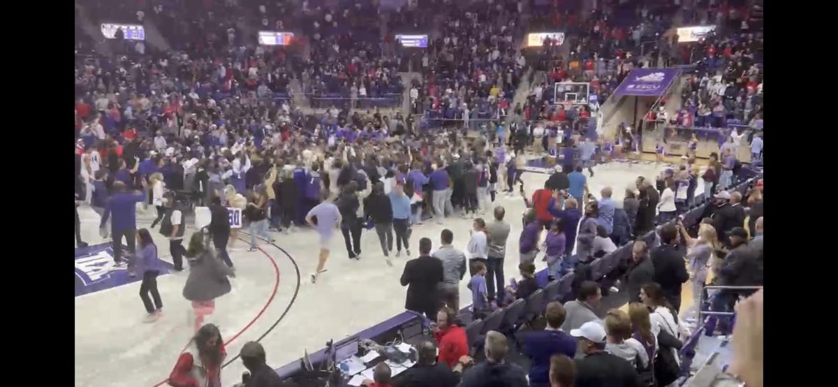 Students storm the court in celebration of TCU's win over #9 Texas Tech